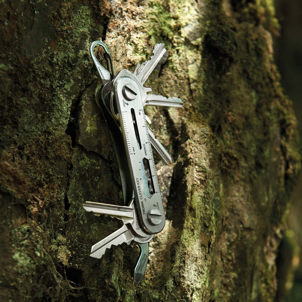Troika Clever Key Organizer Tool shown against tree bark with keys