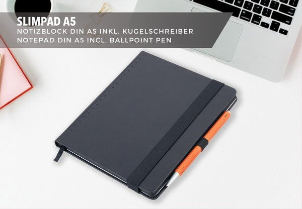 Black Troika notebook with neon orange pen on a white surface, with text about Slimpad A5 notepad and ballpoint pen.