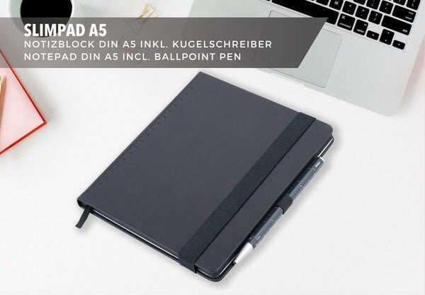 Black Troika notebook with blue pen on a white surface, with text about Slimpad A5 notepad and ballpoint pen.