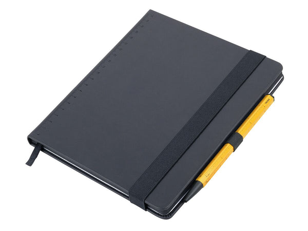 Black Troika A5 notebook with a yellow Troika Basic Construction Ballpoint Pen on a white background