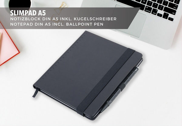 Black Troika notebook with black pen on a white surface, with text about Slimpad A5 notepad and ballpoint pen.