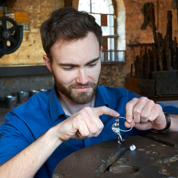 Troika Tipp-Kick Soccer Player Nail Friendly Keyring Item KR17-86/MA showing man playing with the Tipp-Kick Player